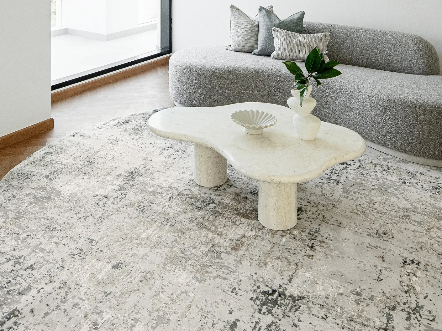 Jay Haywoods Round carpet in grey, shown in a lifestyle front view