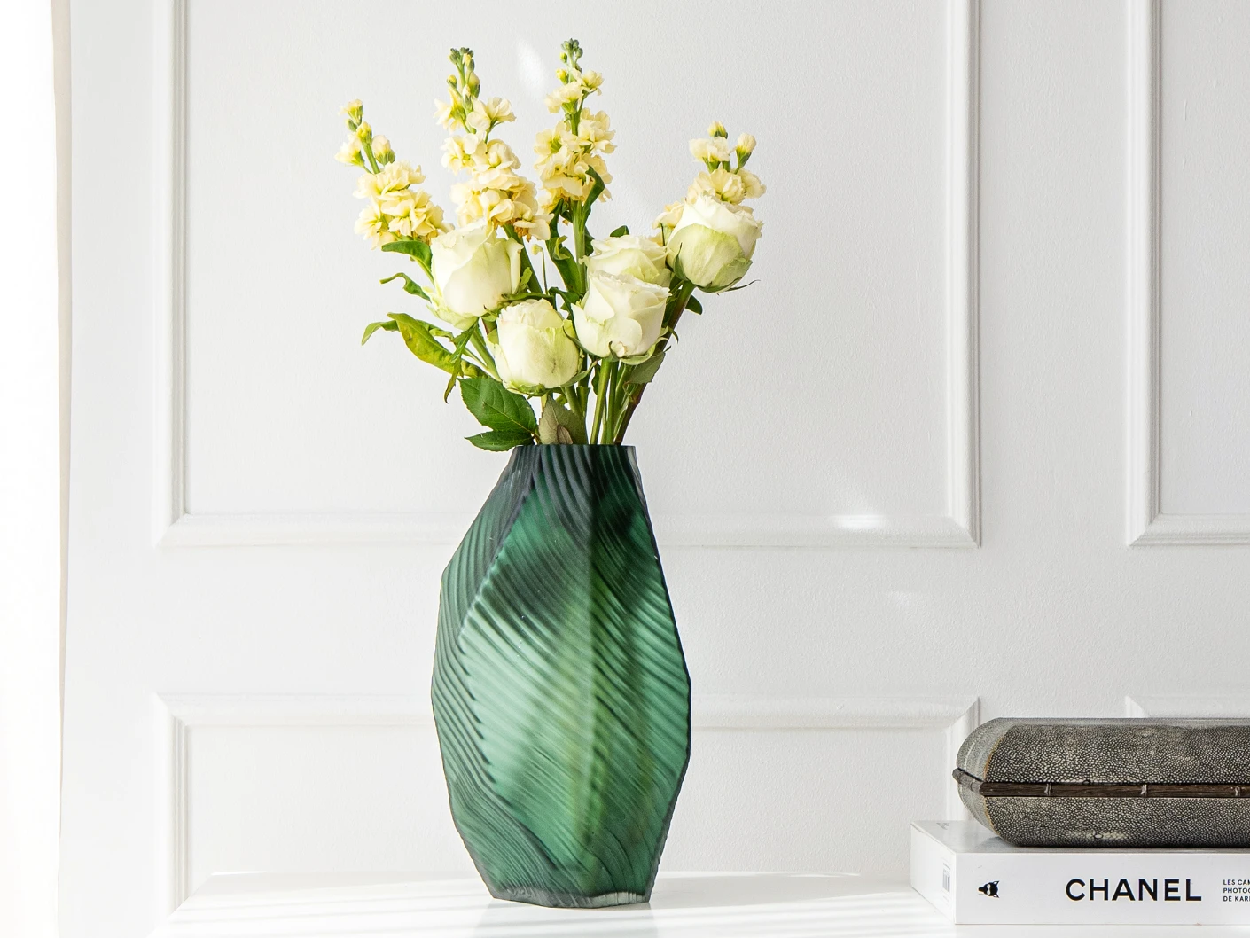 Keira Storms II vases in green, shown in a lifestyle front view