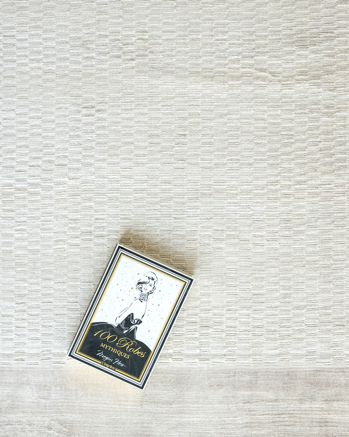 Luna Clay carpet in beige, shown in a lifestyle top view as image 6