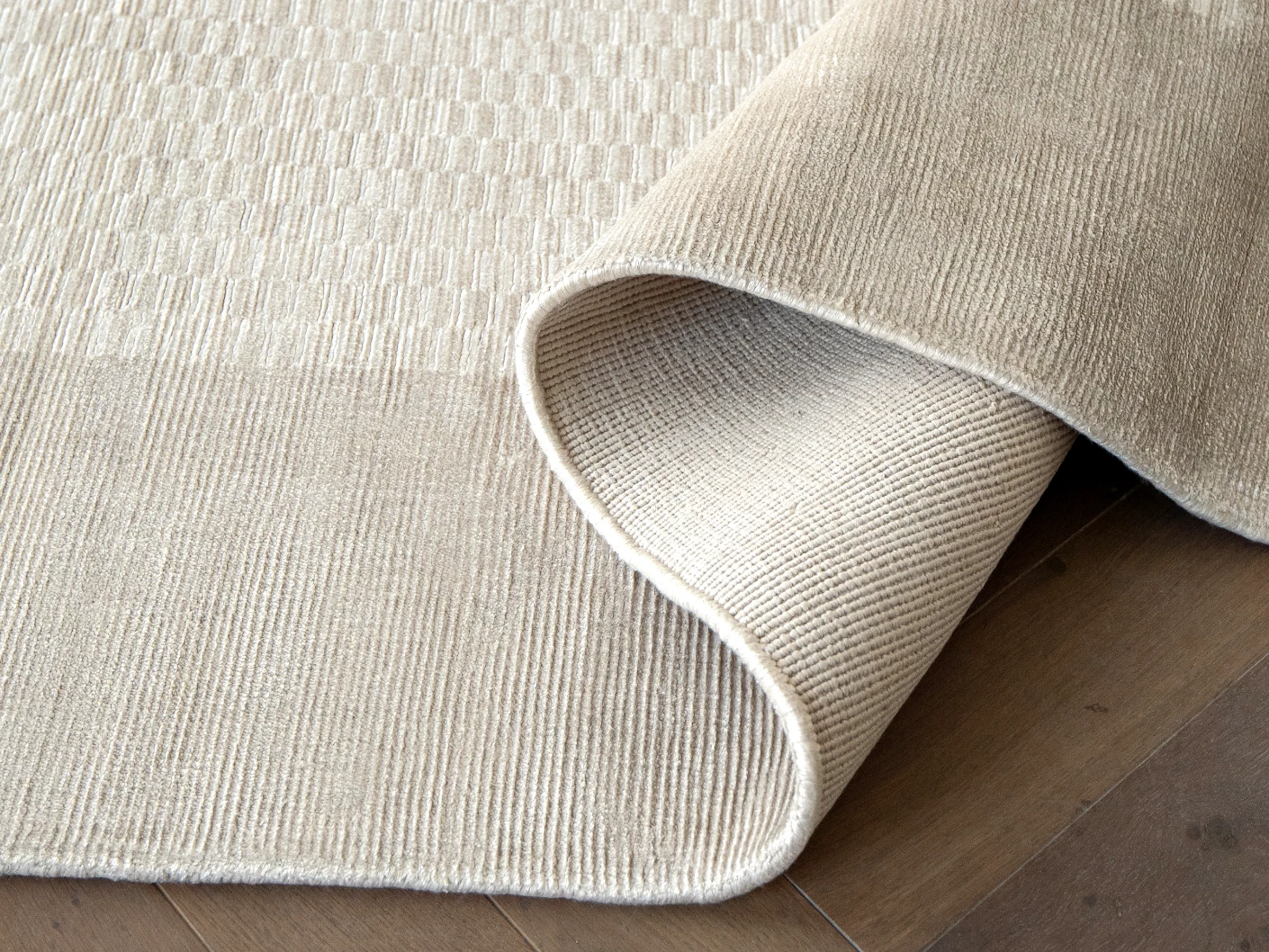 Luna Clay carpets in clay and beige, shown in a product close-up view