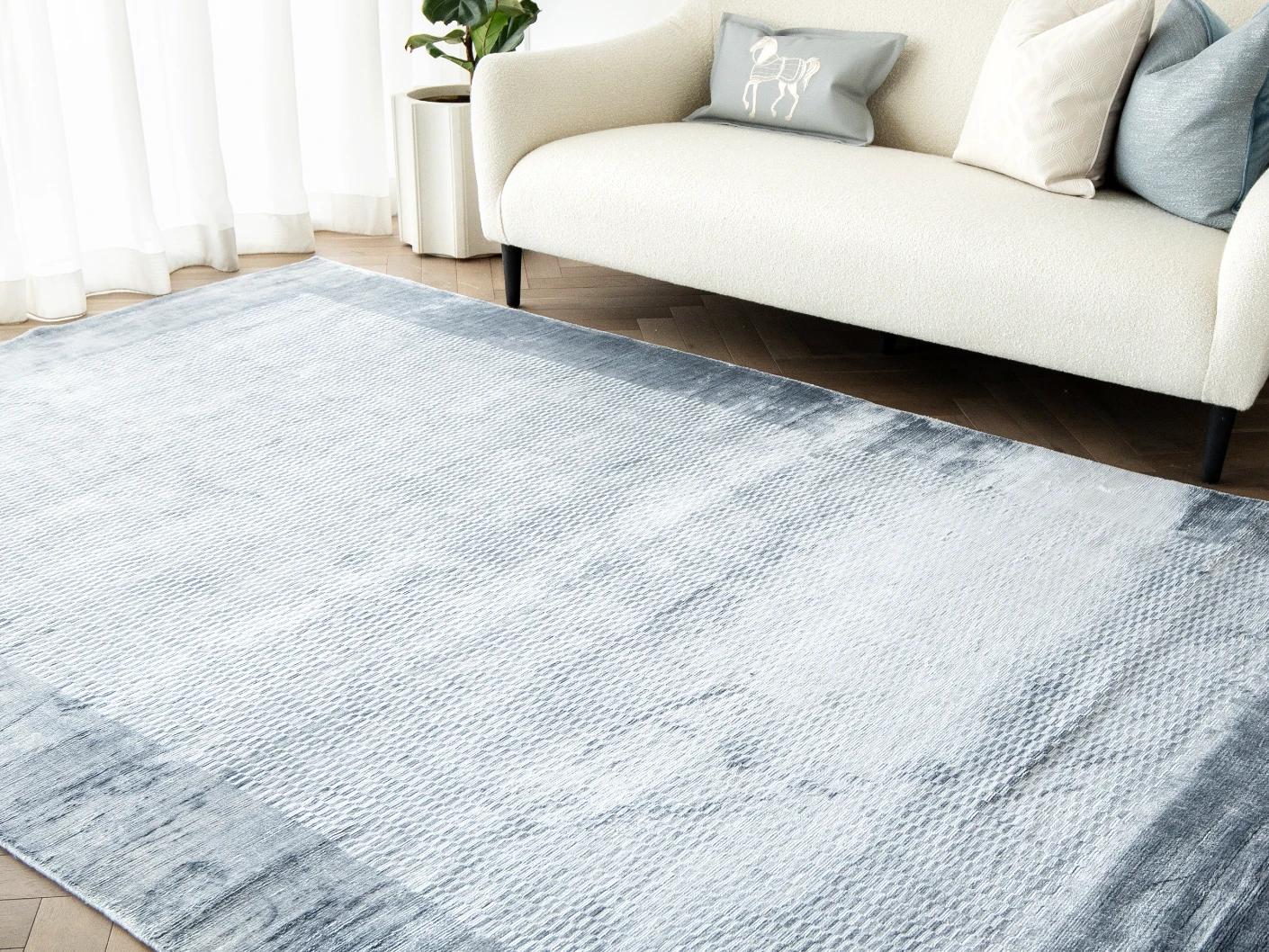 Luna Sky carpets in blue, shown in a lifestyle right view as image 3
