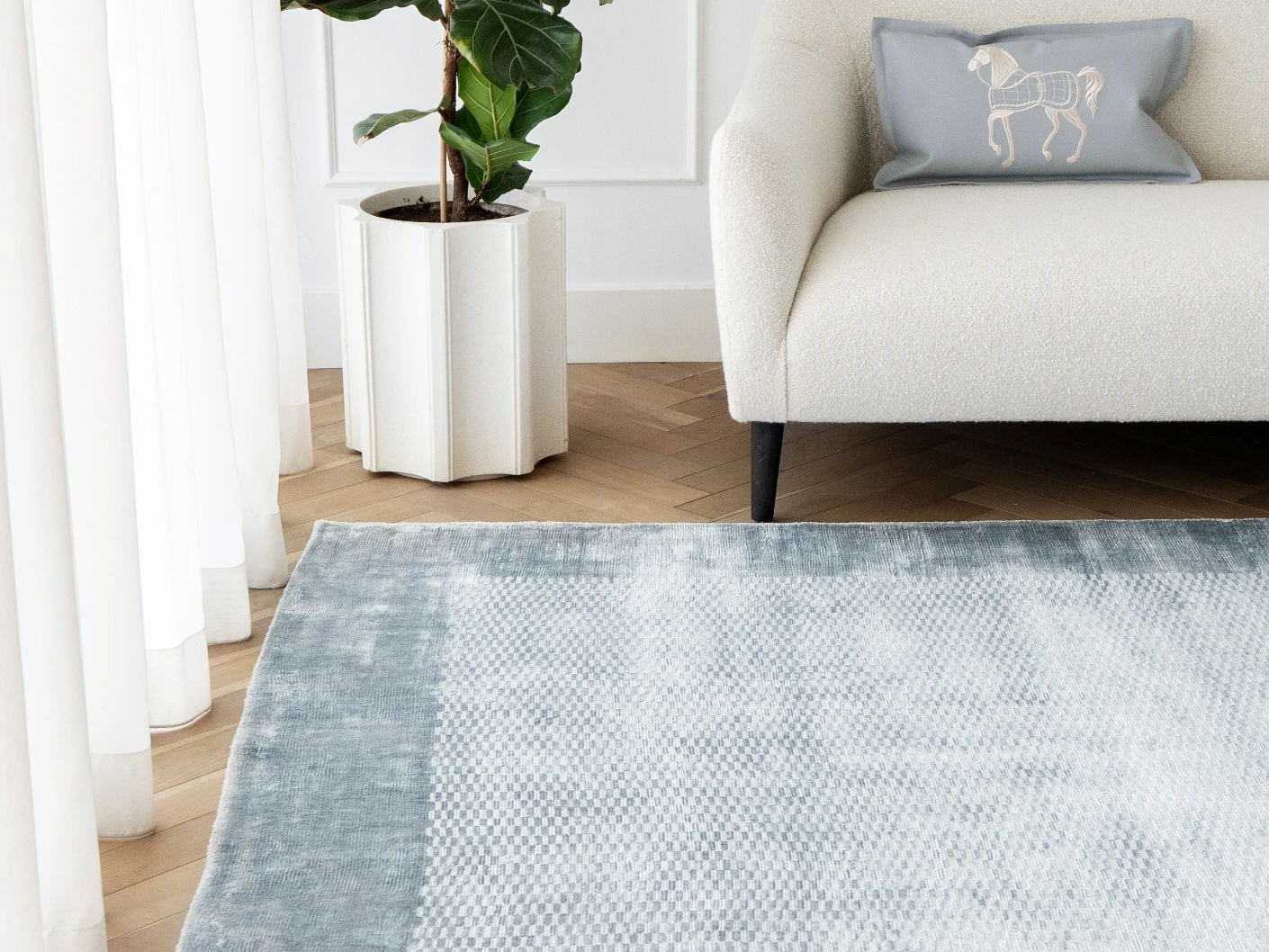 Luna Sky carpet in sky and blue, shown in a lifestyle front view