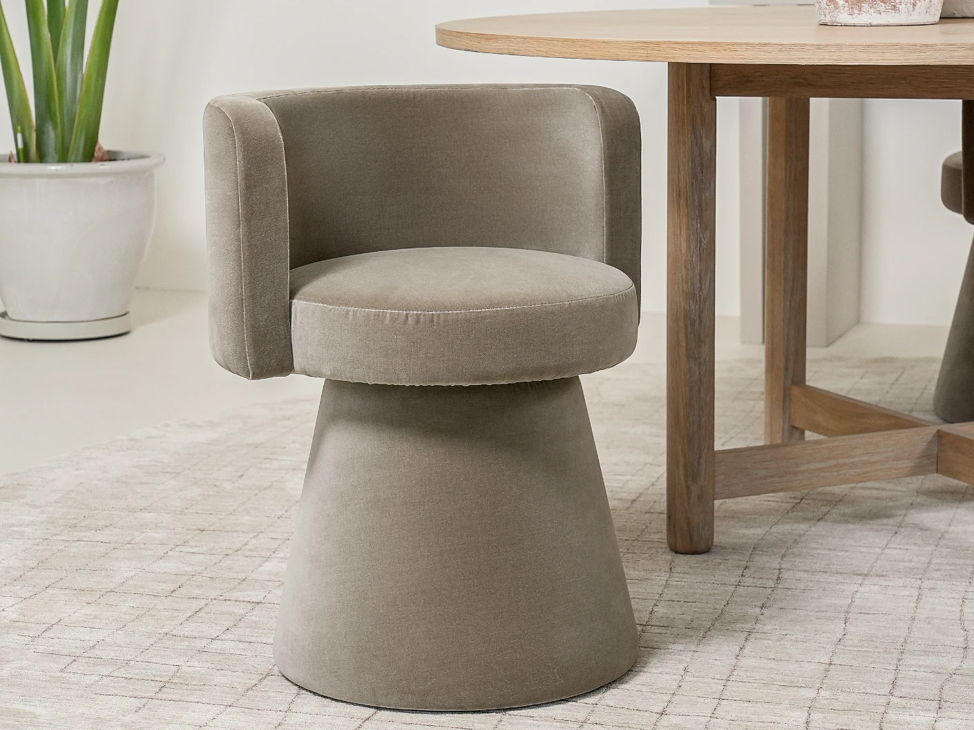 Mara Alpaca swivel chair in brown, shown in a lifestyle left view as image 3