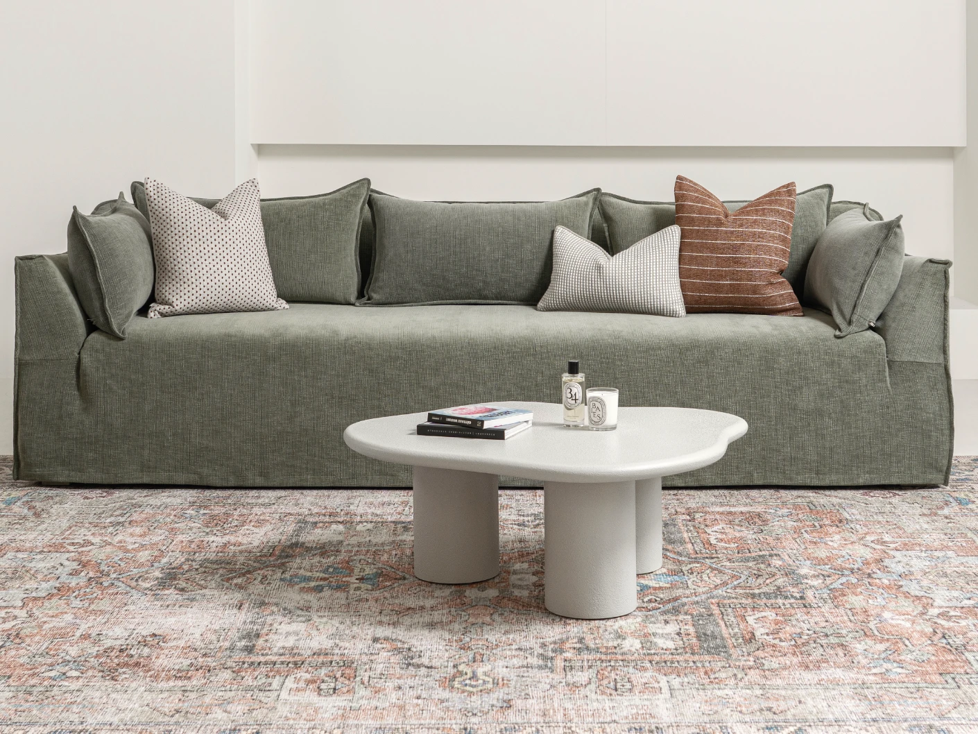 Pienza coffee table in soft ivory and stone, shown in a lifestyle front view as image 1