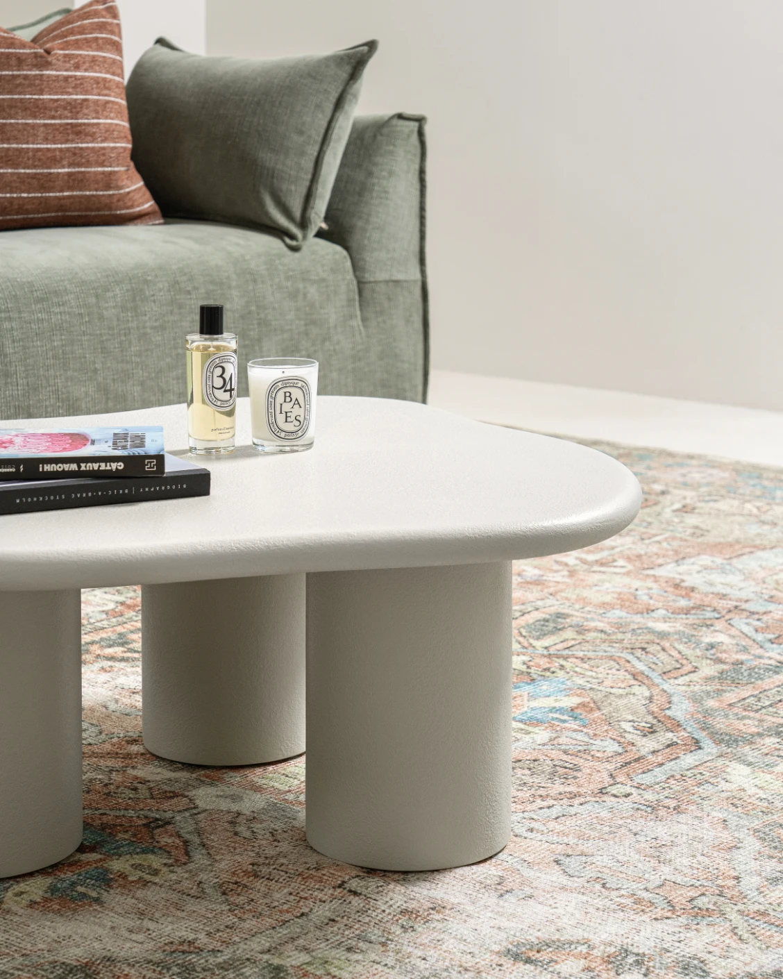 Pienza coffee table in soft ivory and stone, shown in a lifestyle left view as image 3