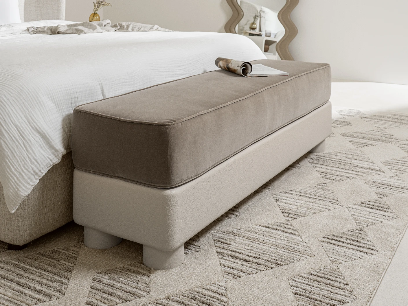 Rina bench in warm taupe, ivory and taupe, shown in a lifestyle left view