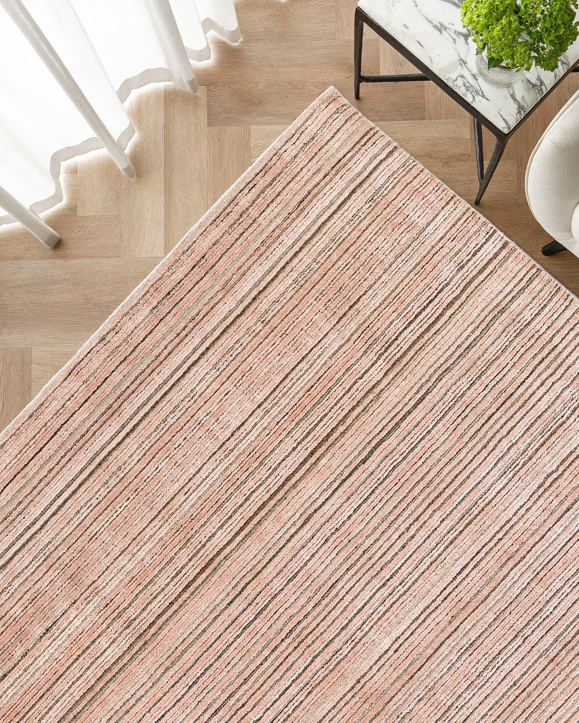 Rita Rosso carpet in pink, shown in a lifestyle top view as image 2