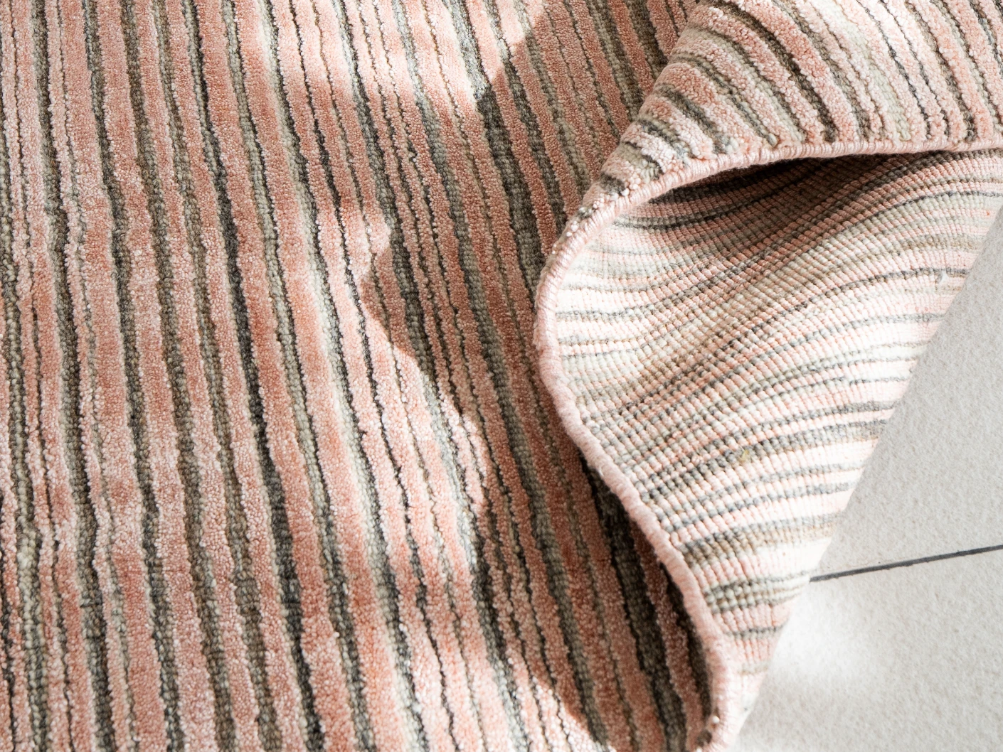 Rita Rosso carpets in pink, shown in a product close-up view