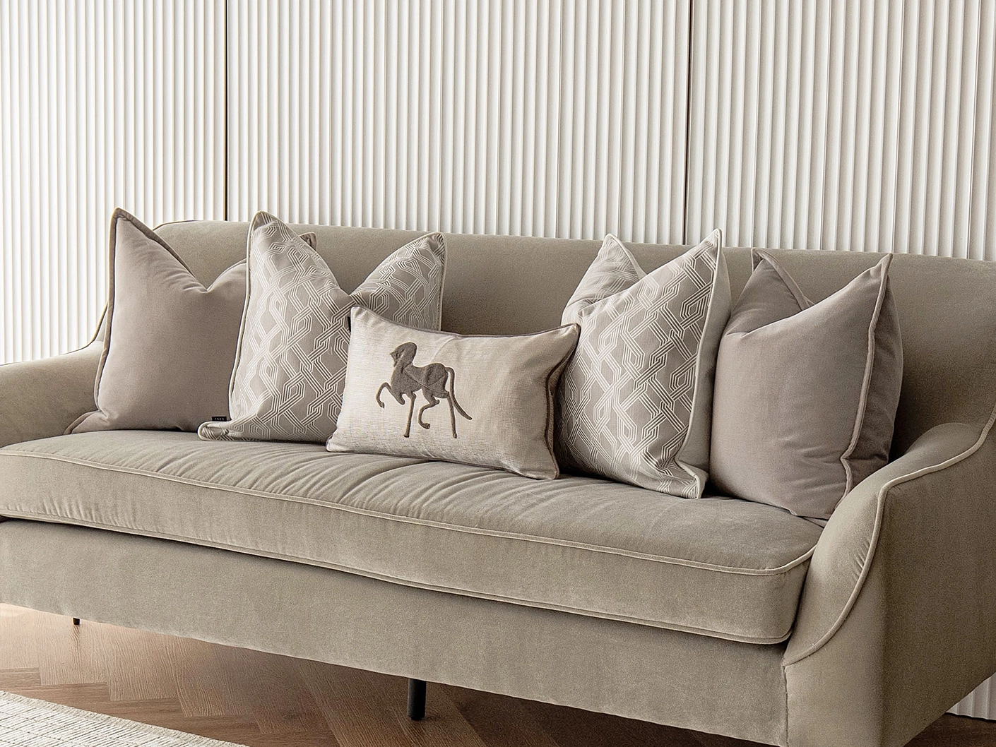 Sherwin Bundle bundle cushions in beige, white and brown, shown in a lifestyle front view