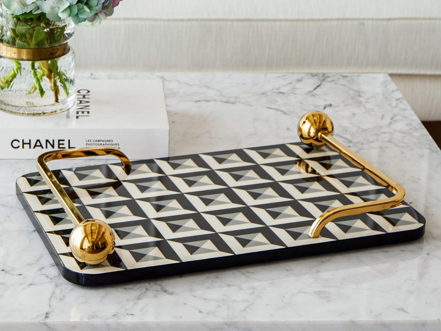 Stephen Bandiagara trays in black and gold, shown in a lifestyle front view