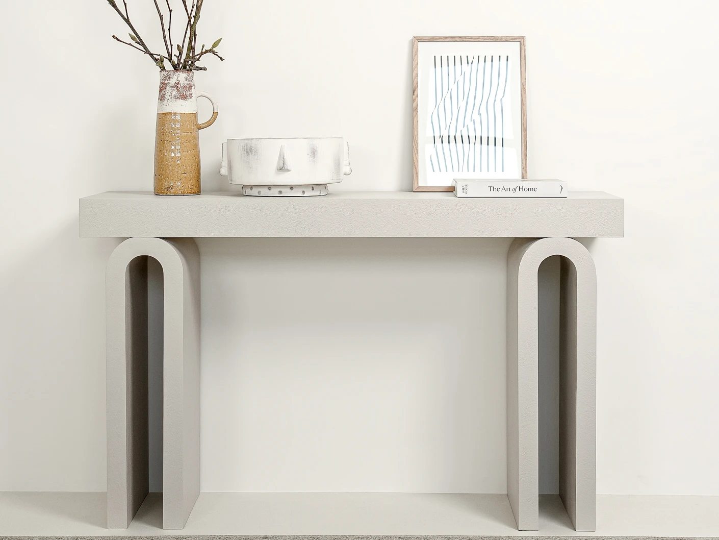 Trento console table in soft ivory and stone, shown in a lifestyle front view as image 2