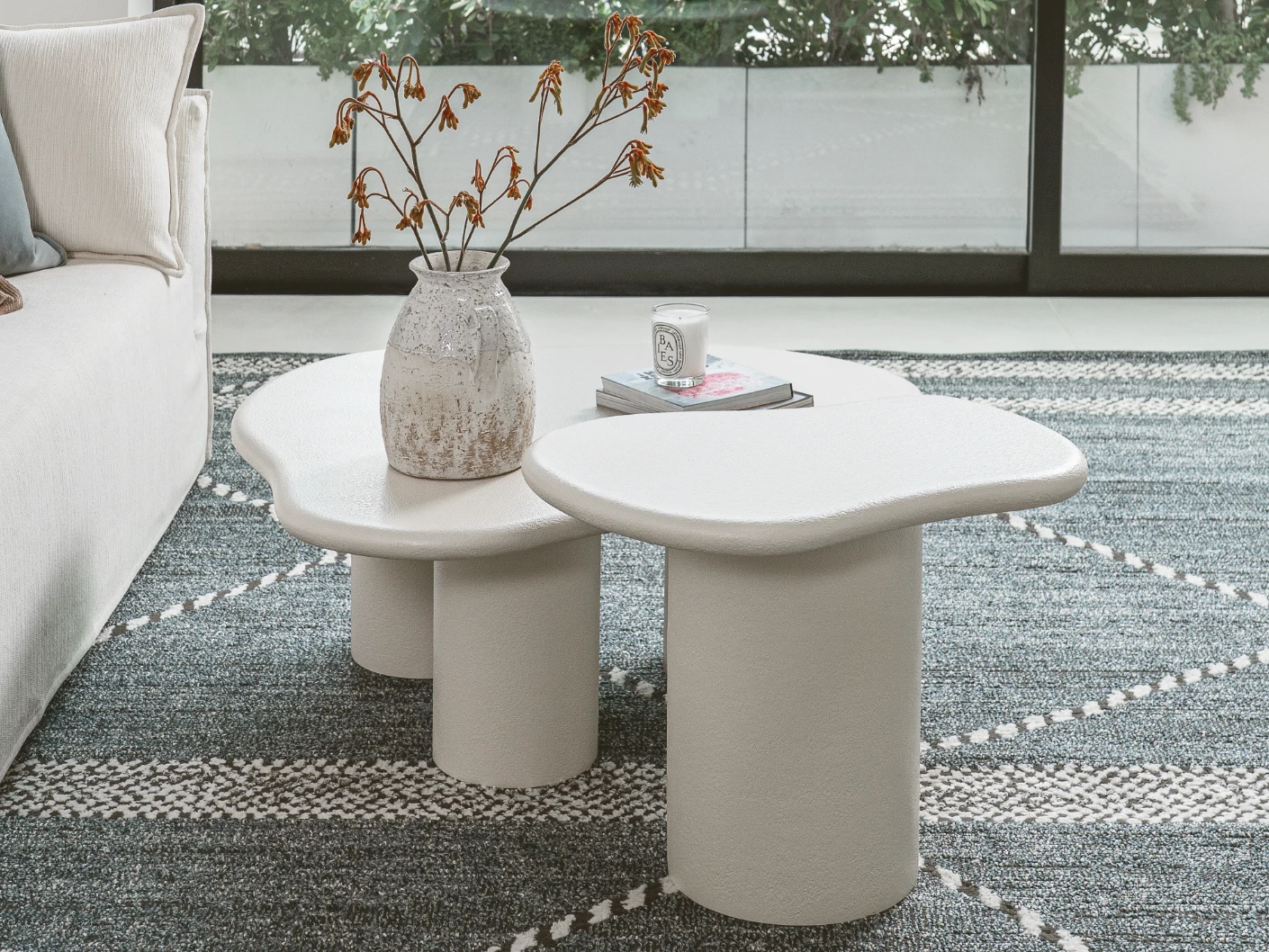 Verona side table in soft ivory and stone, shown in a lifestyle left view as image 3