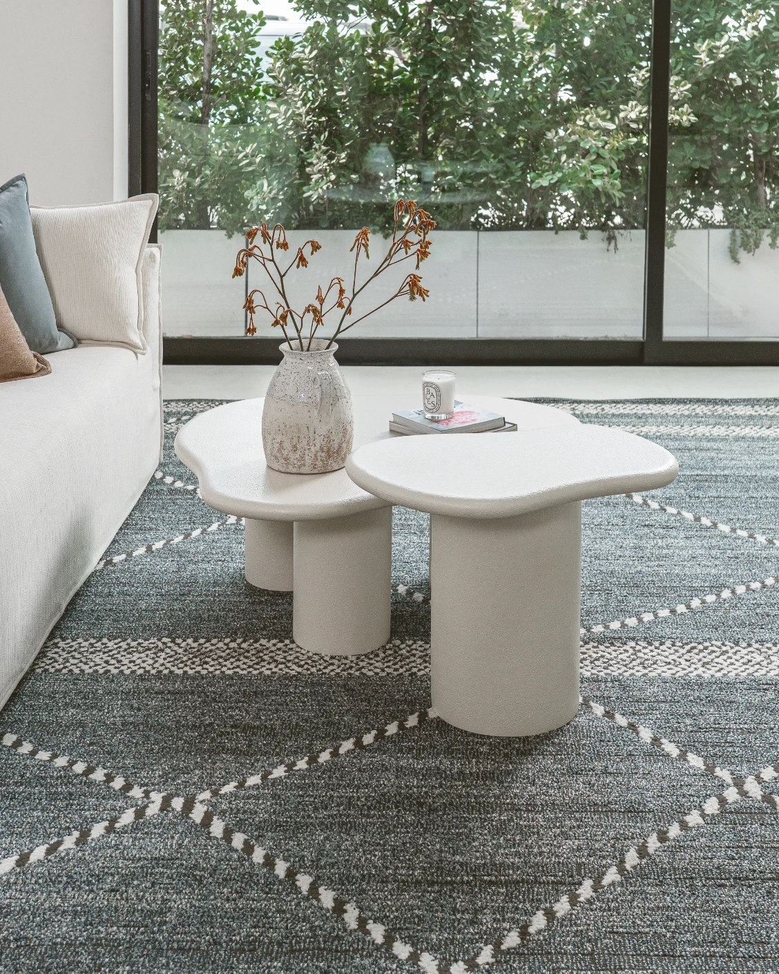 Verona side table in soft ivory and stone, shown in a lifestyle left view as image 3