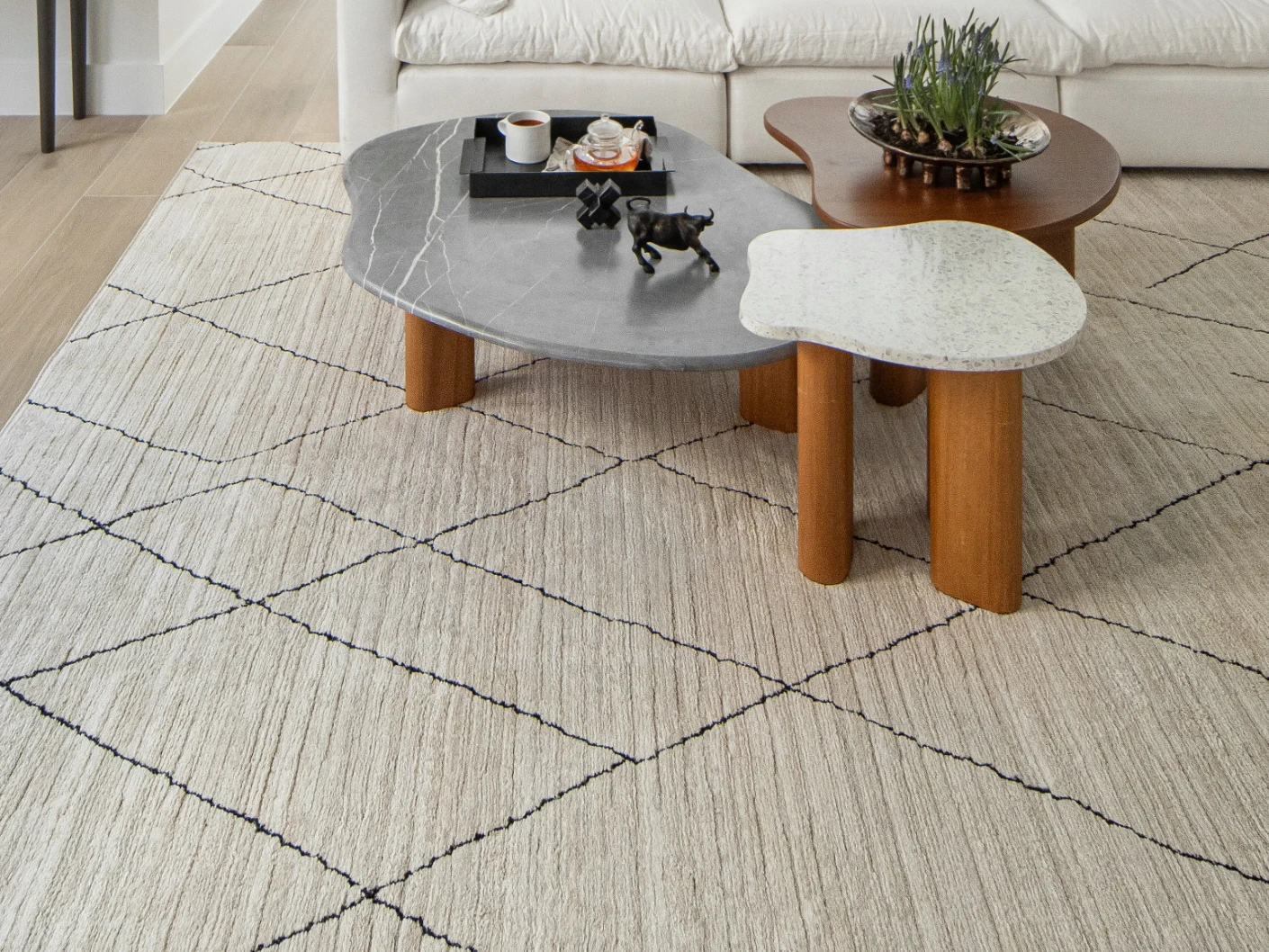Zen Pearl carpet in pearl, charcoal and ivory, shown in a lifestyle front view