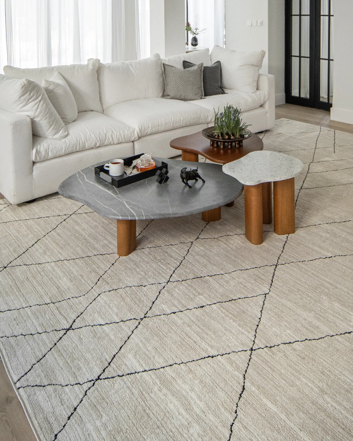 Zen Pearl carpet in charcoal and ivory, shown in a lifestyle left view as image 7