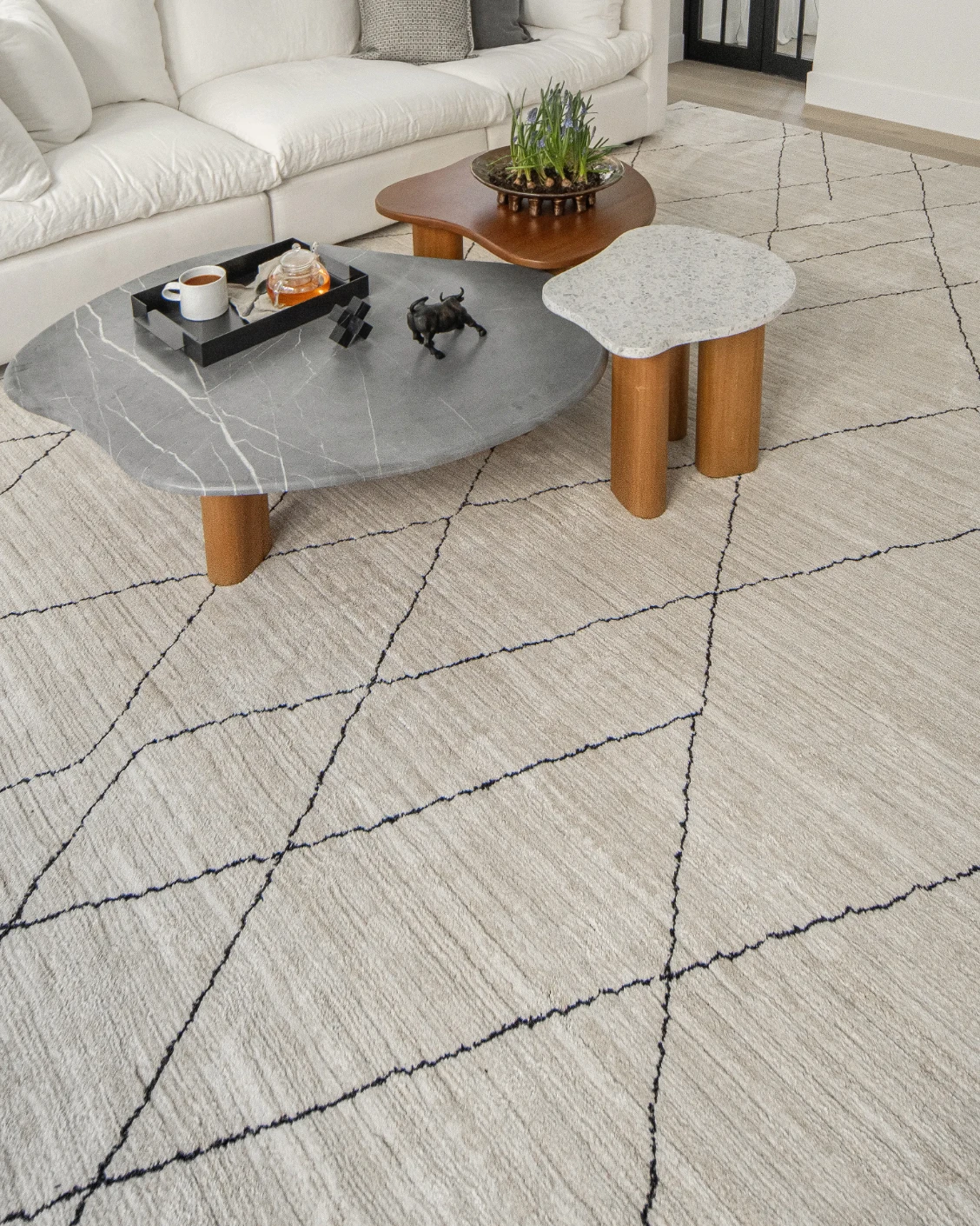 Zen Pearl carpet in charcoal and ivory, shown in a lifestyle left view as image 8