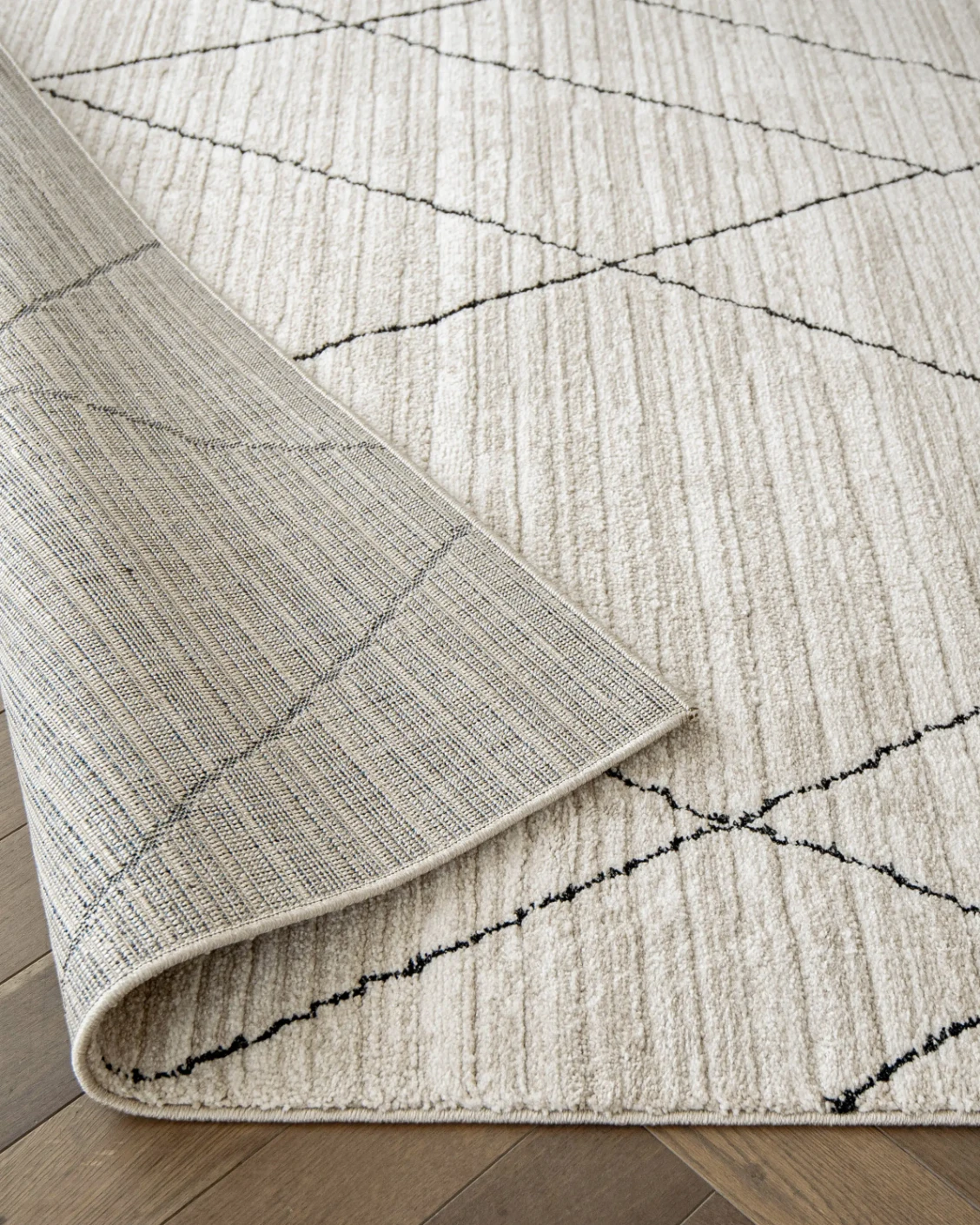 Zen Pearl carpet in charcoal and ivory, shown in a product close-up as image 11