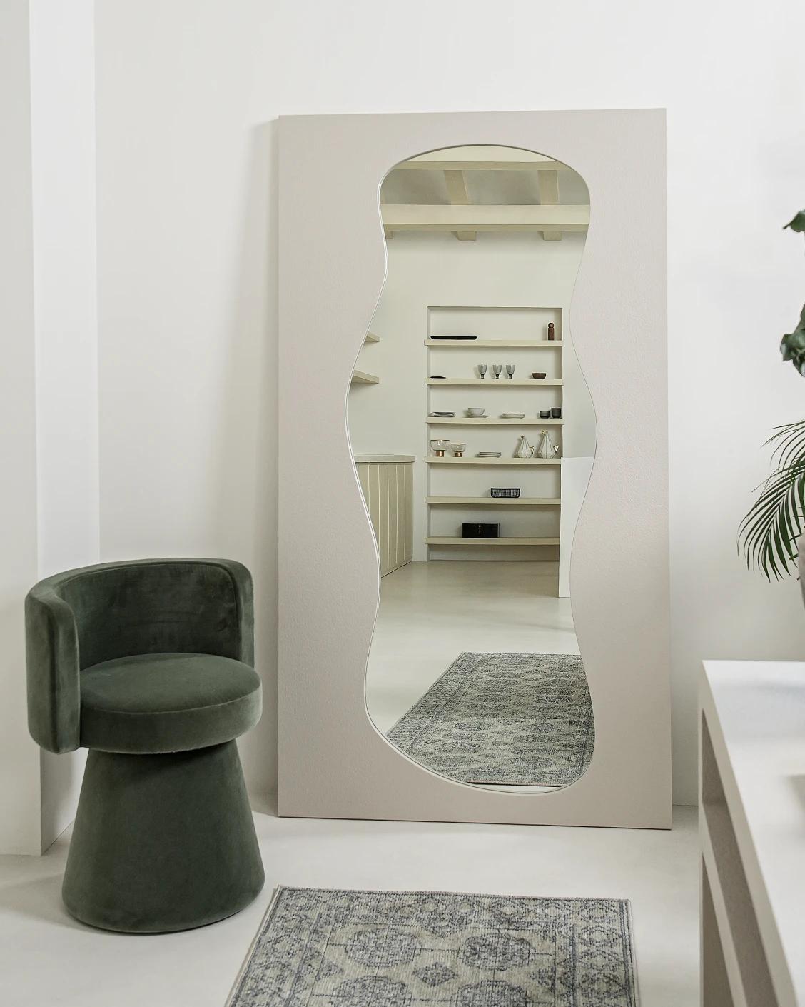 Ivrea mirror in soft ivory and stone, shown in a lifestyle front view as image 2
