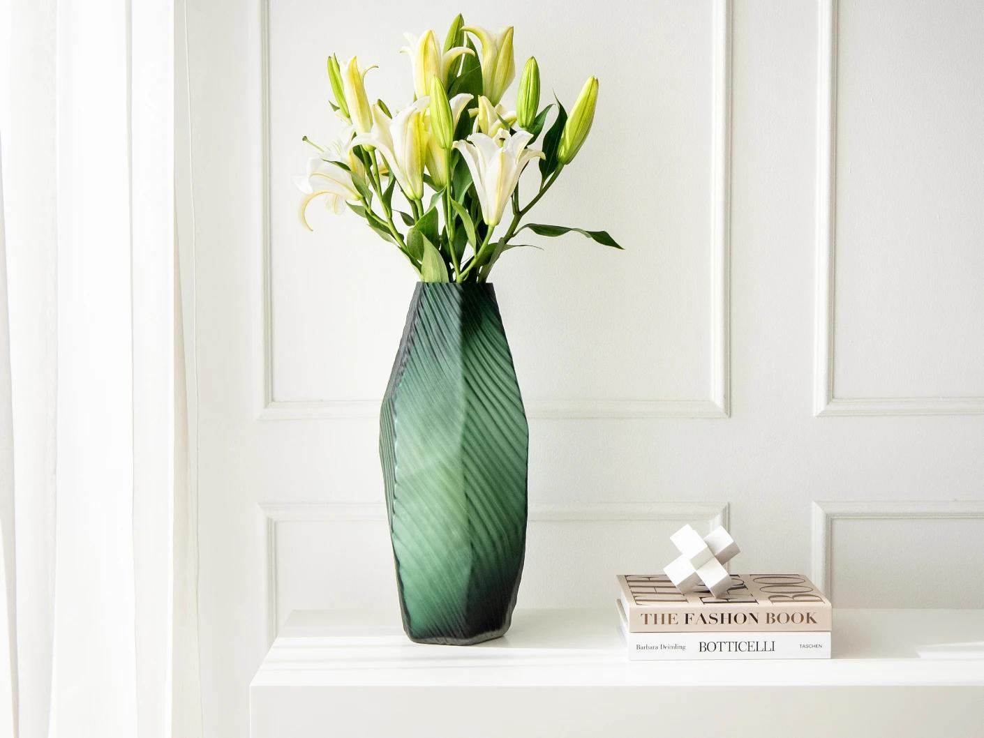 Keira Storms vases in green, shown in a lifestyle front view as image 2