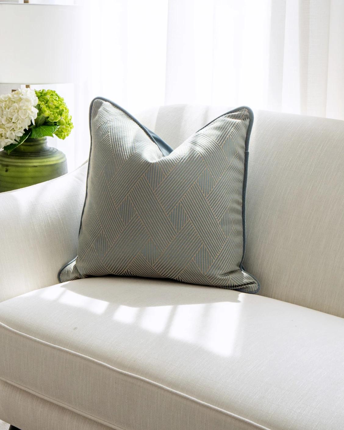 Lucas Matisse cushion in blue, shown in a lifestyle front view as image 2
