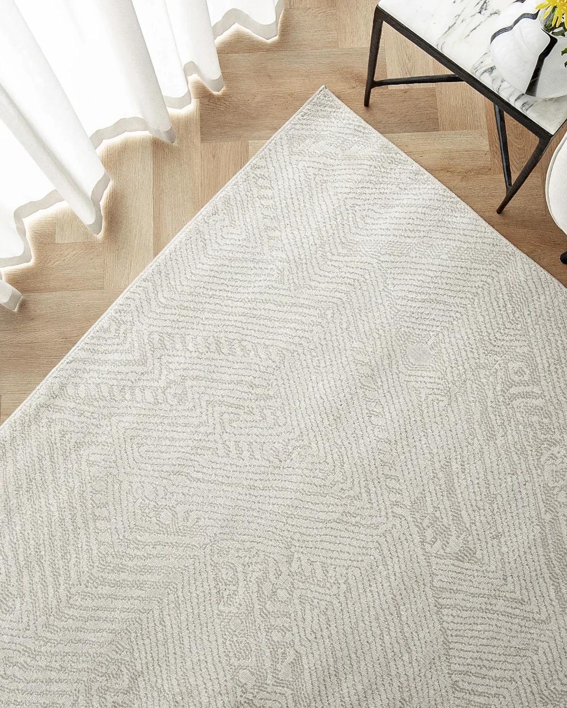 Marco Sandy carpet in beige, shown in a lifestyle top view as image 2