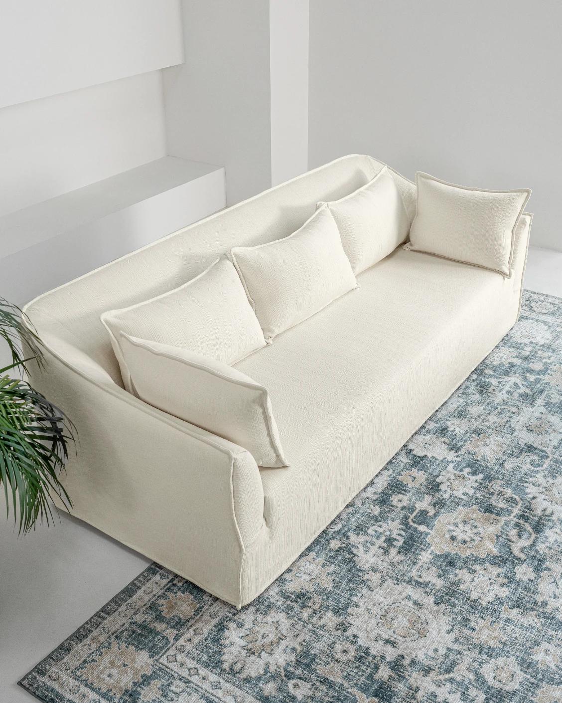Miro Warm Ivory sofa, shown in a lifestyle top view as image 7