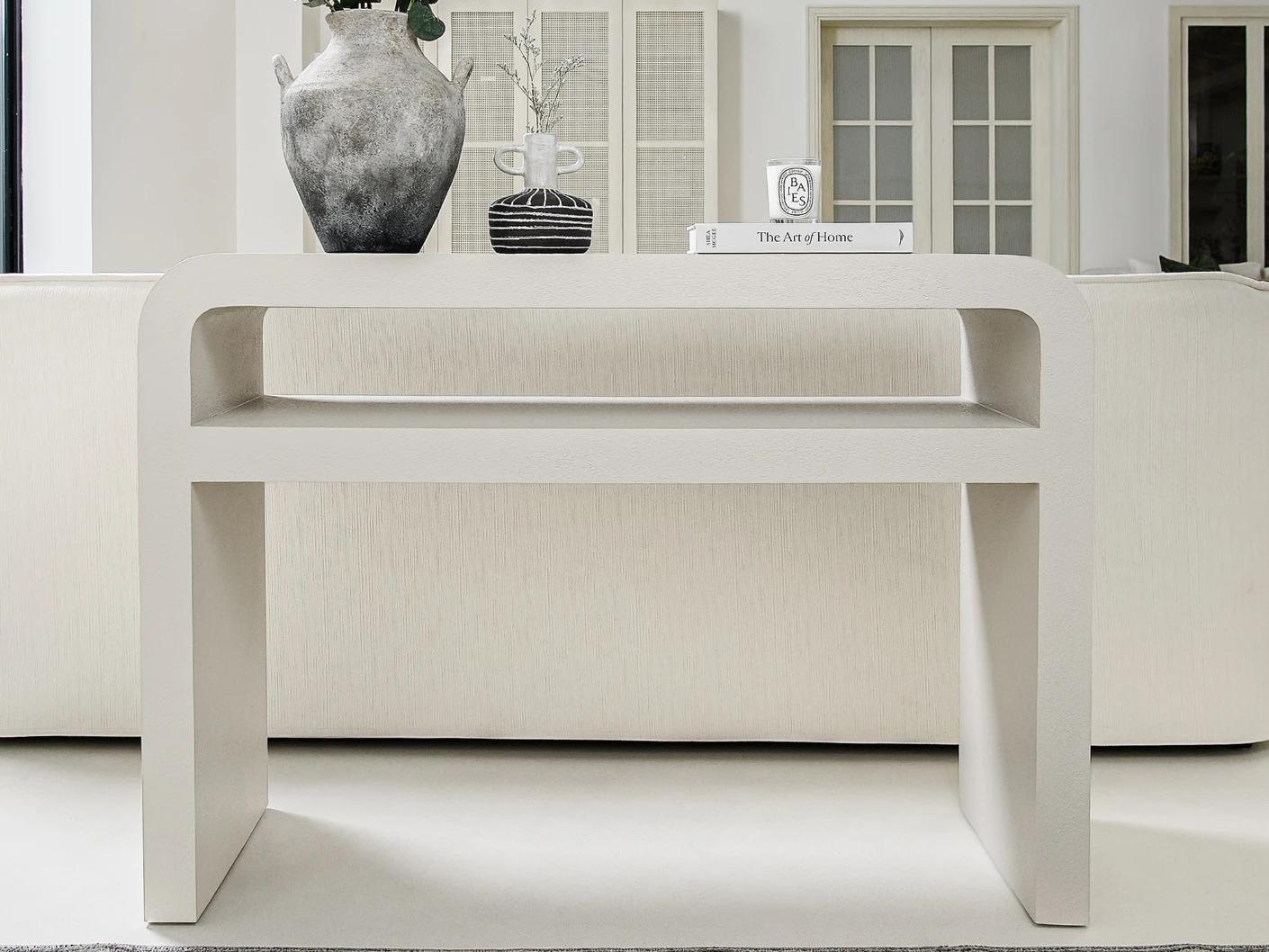 Orta console table in soft ivory and stone, shown in a lifestyle front view as image 2