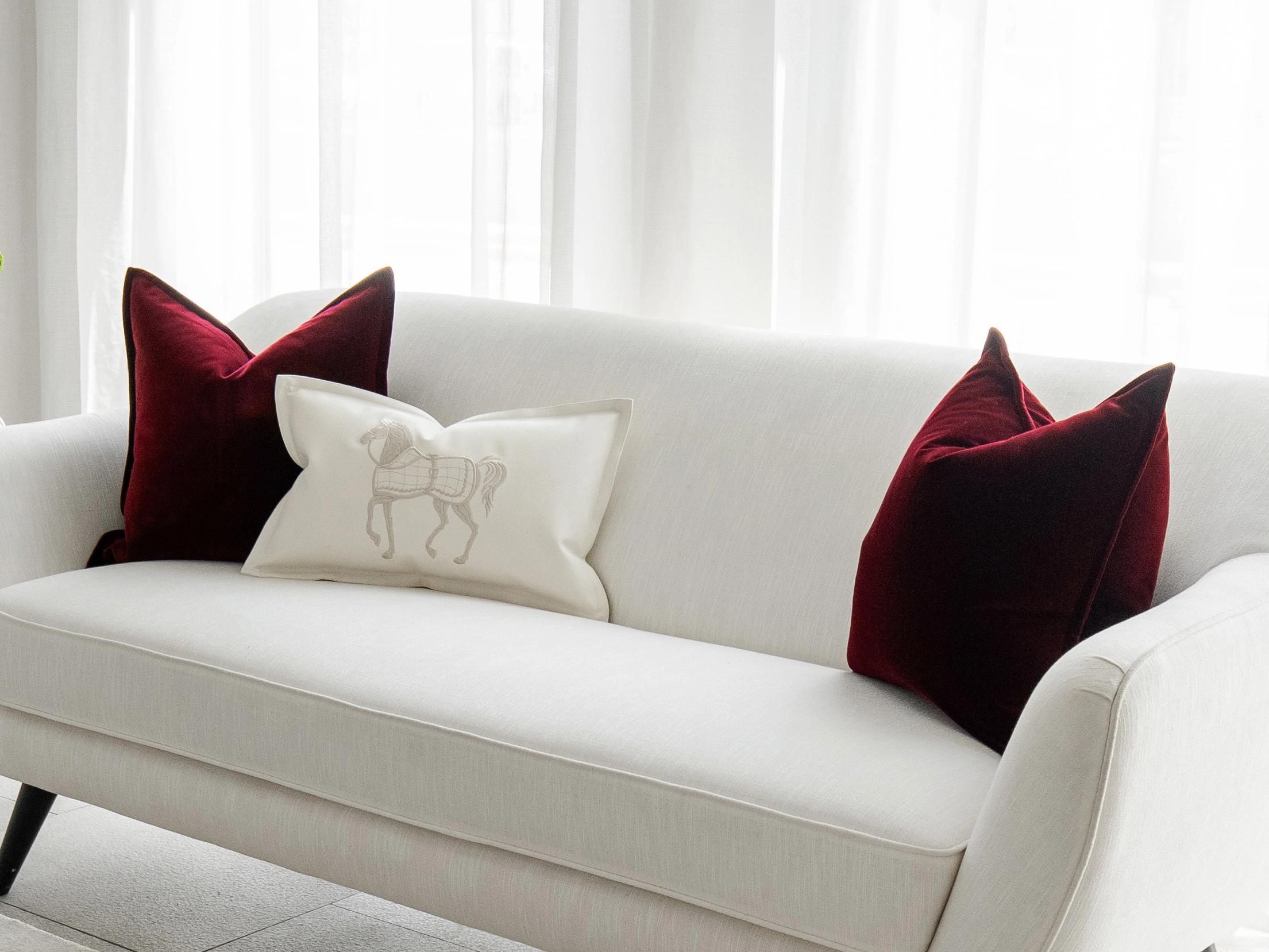Garnet Bundle cushion in red, shown in a lifestyle right view as image 2