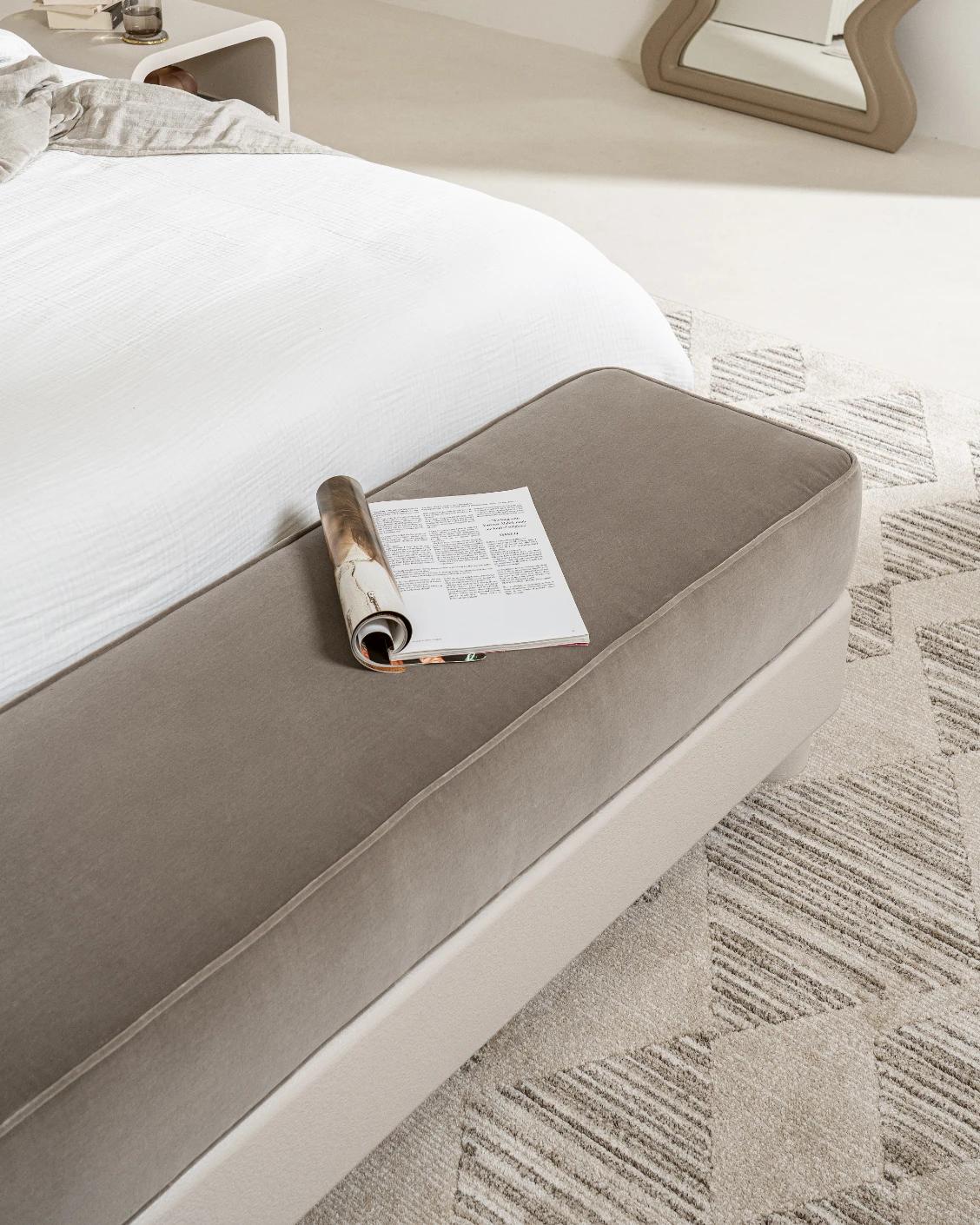 Rina bench in warm taupe, ivory and taupe, shown in a lifestyle top view as image 9