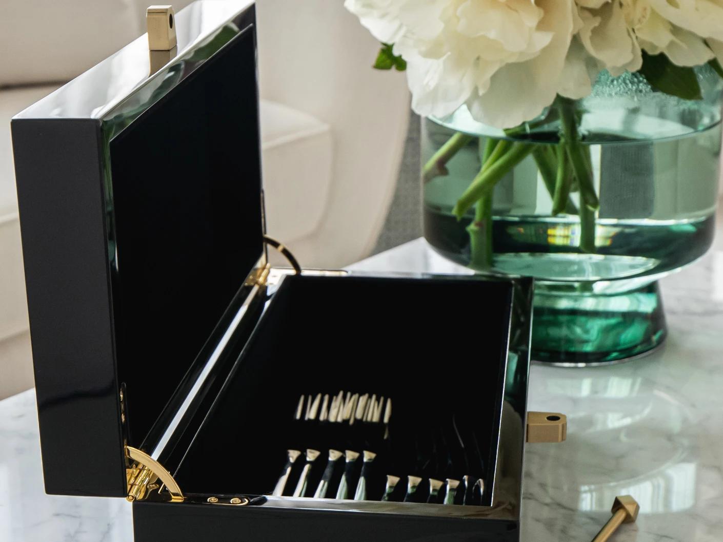 Romare Cornell accessory in black, shown in a lifestyle left view as image 4