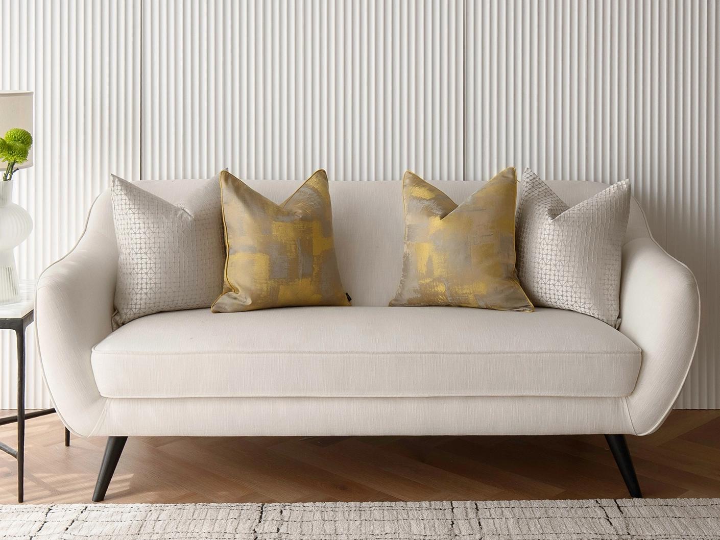 Gustave Bundle cushion in silver and gold, shown in a lifestyle front view as image 4