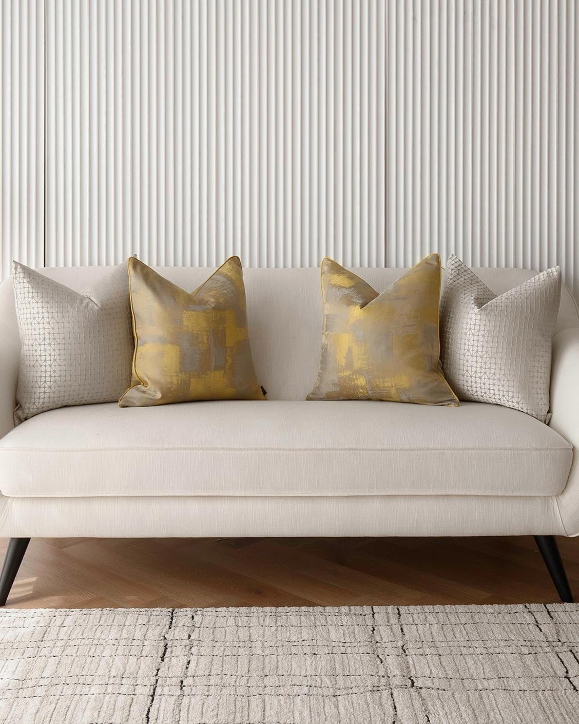 Gustave Bundle cushion in silver and gold, shown in a lifestyle front view as image 4