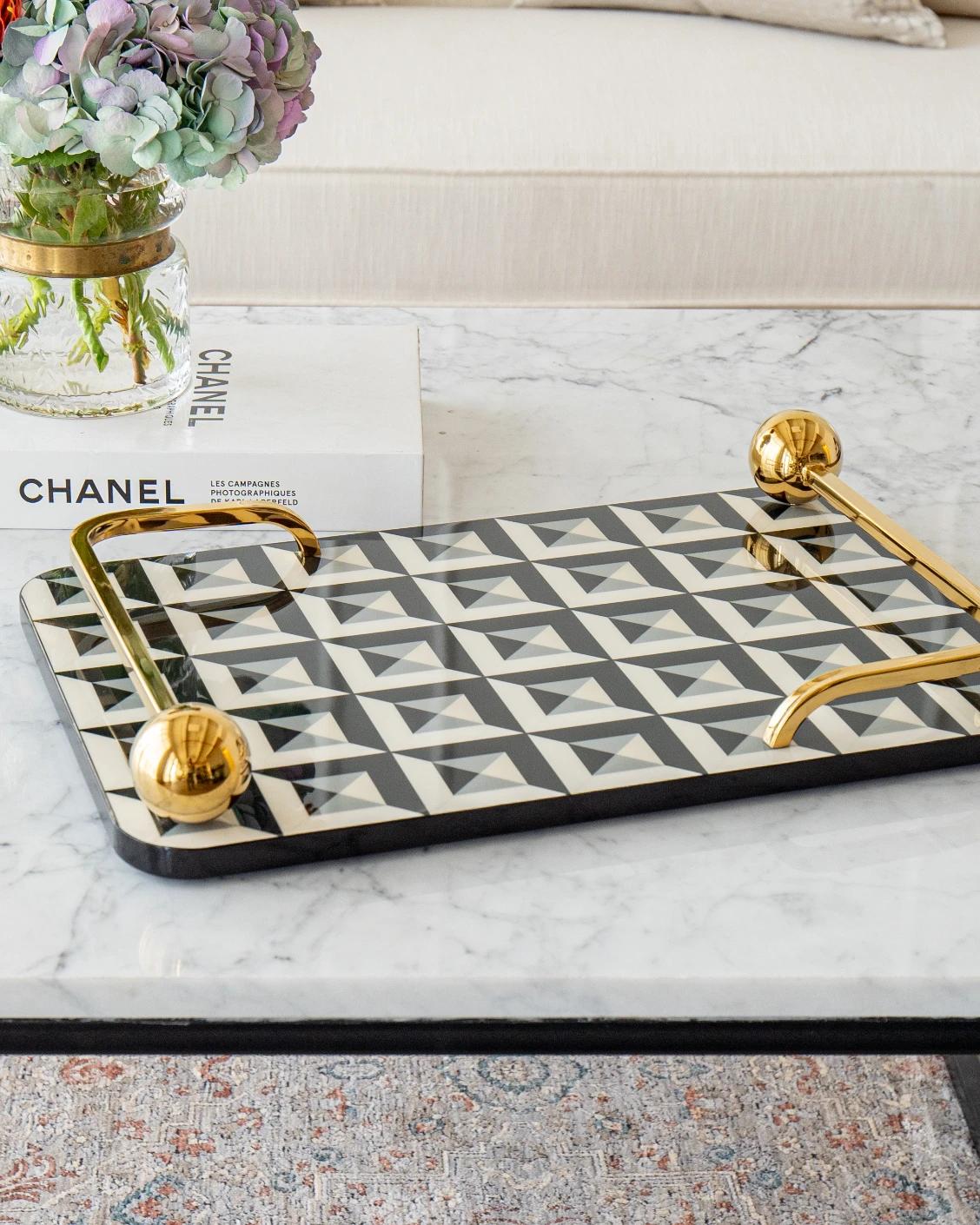 Stephen Bandiagara trays in black and gold, shown in a lifestyle front view as image 6